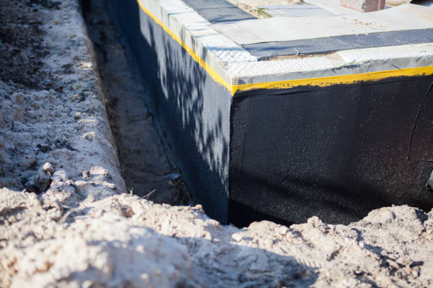 Professional Emergency Waterproofing technician working in Springville, NY